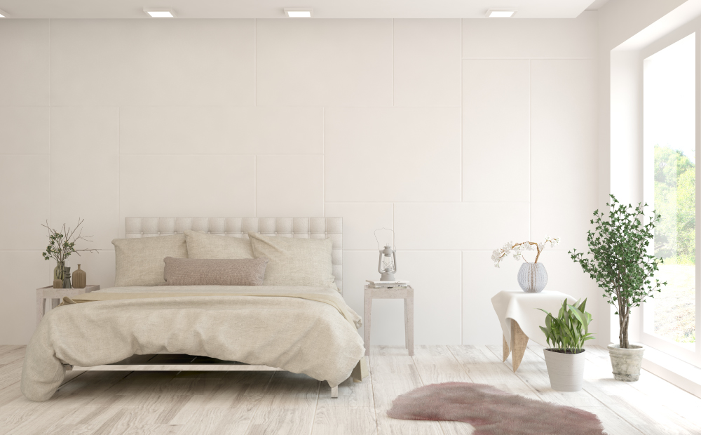 Light Bed Frame with Off-White Bedding in White Bedroom